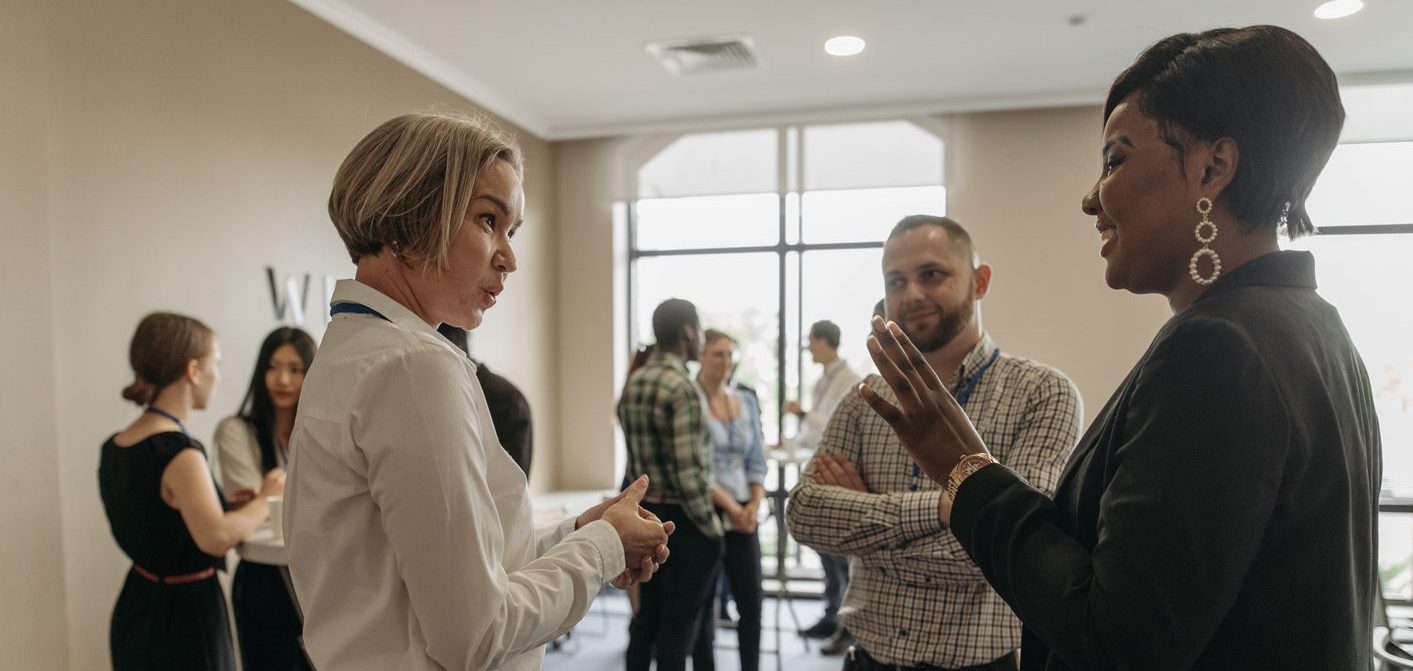 People grouped together talking.